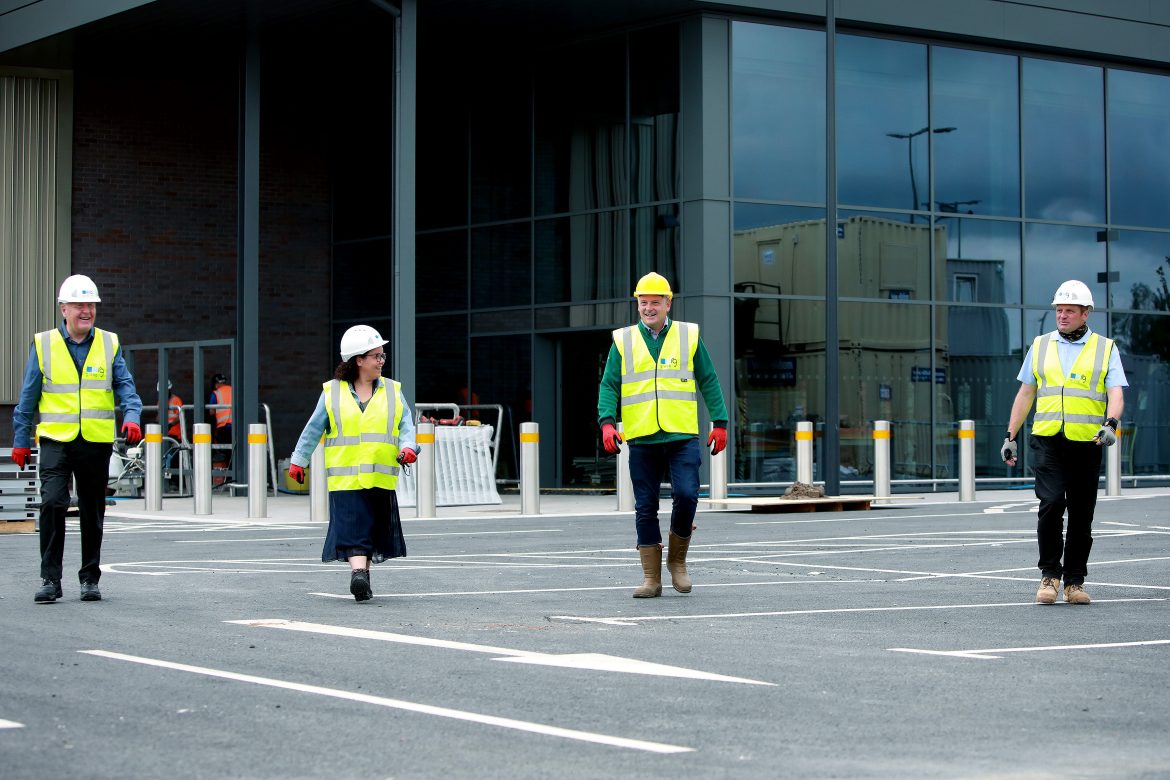 Knowsley Council Deputy Leader Louise harbour and Cabinet Member for Regeneration and Economic Development Tony Brennan receiving a guided tour of the new Morrisons supermarket by Morrison’s Senior Development Manager James Smith and rg group Account Manager Neil Haire.