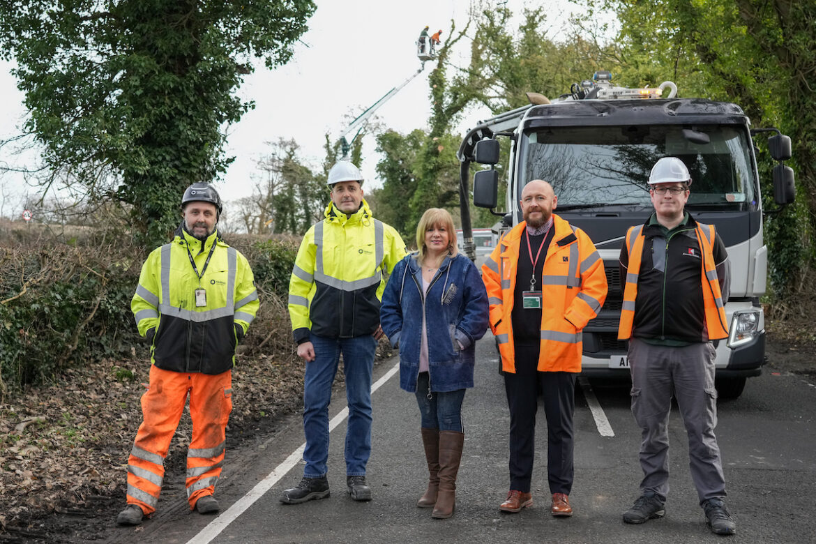 council workmen and councillor standing in front of lorry