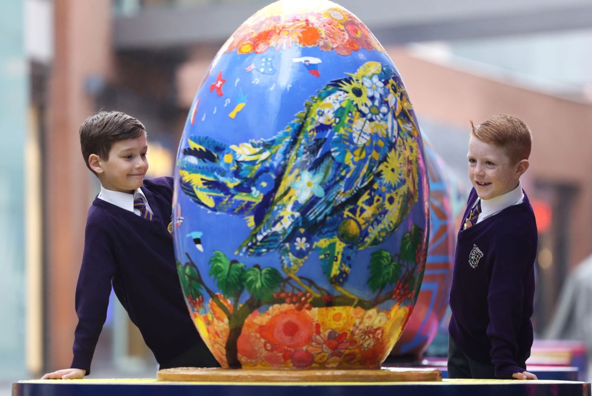 Pupils from St Joseph the Worker Primary School with their painted egg at Liverpool ONE