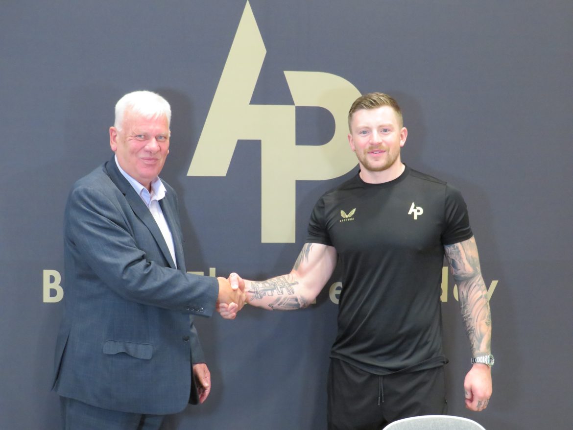 Cllr Graham Morgan Shales hands with Olympian Adam Peaty