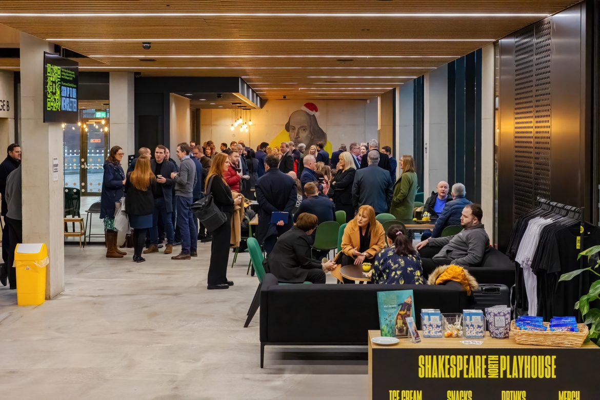 Attendees at the Knowsley Ambassador meeting networking and enjoying refreshments at the Shakespeare North Playhouse cafe.