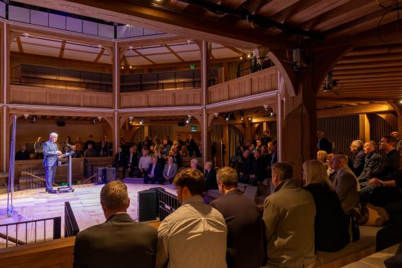 KMBC Ambassadors event SNP 24 Jan 2024 (1 of 1)-32 An audience at the Shakespeare North Playhouse watch on as a speaker addresses them from the stage.