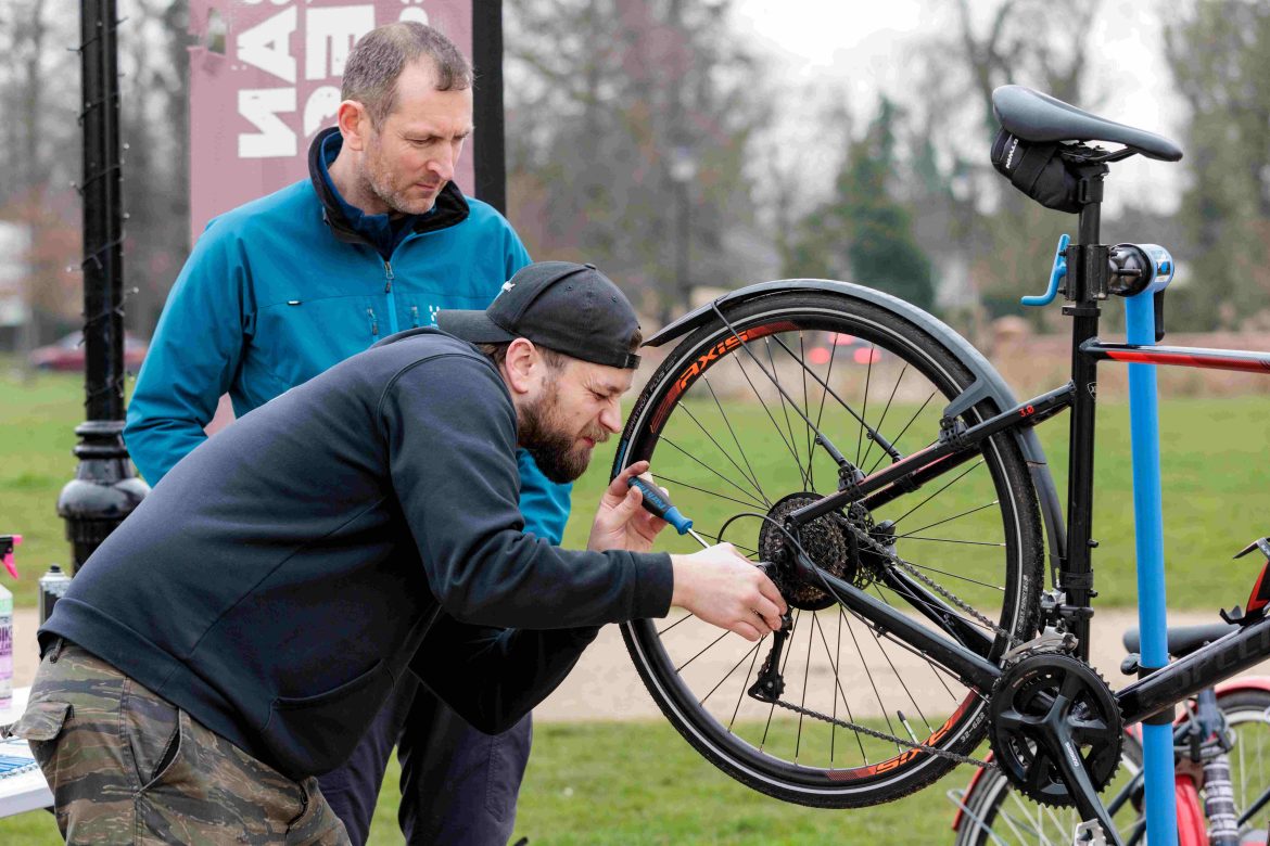man repairing bike