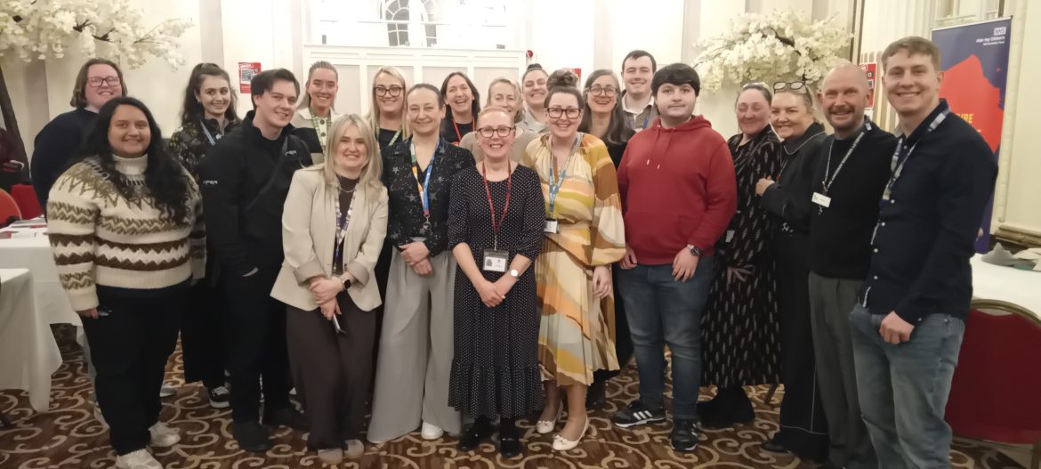 Organisers and stall holders pose ahead of the event